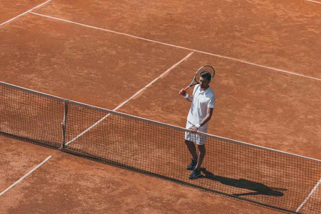 high angle view of man resting on tennis court after match - Photo, Image