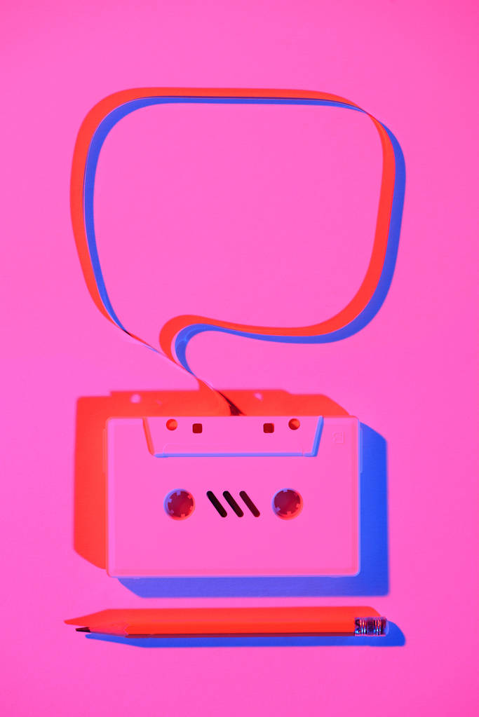 toned pink picture of pencil and retro audio cassette with speech bubble - Photo, Image