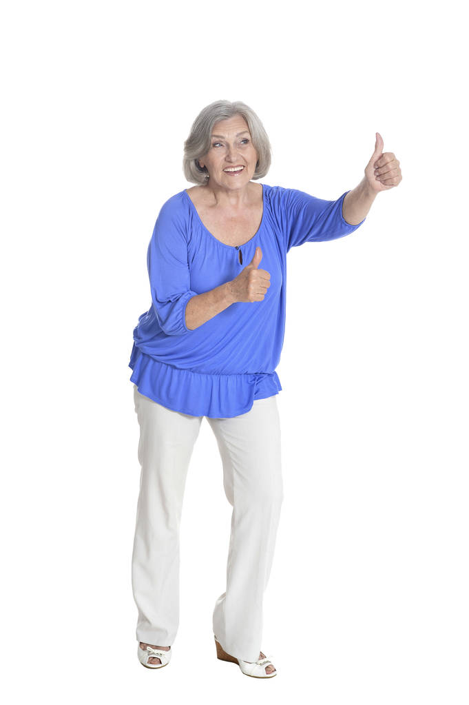 повна довжина, щаслива старша жінка з великими пальцями вгору, ізольована на білому
 - Фото, зображення