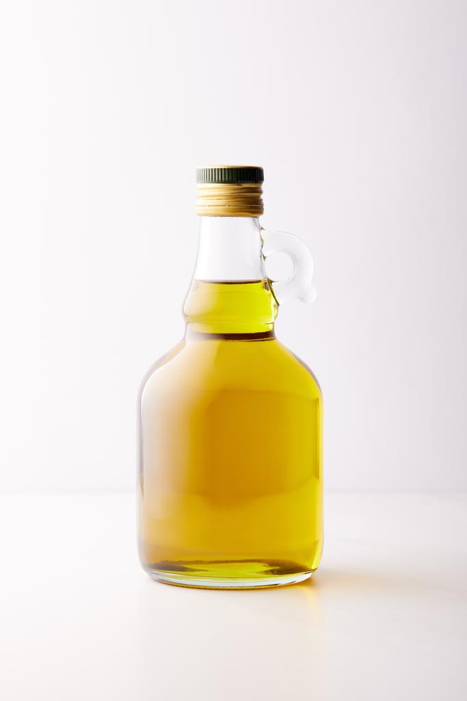 bottle of extra virgin olive oil isolated on grey background  - Photo, Image
