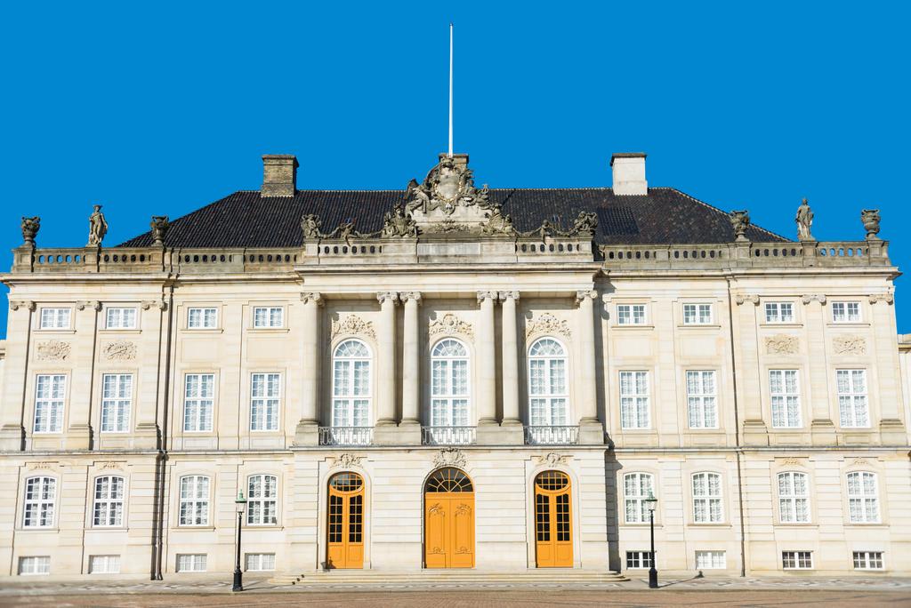 beautiful architecture of historical Amalienborg castle with columns and statues in copenhagen, denmark - Photo, Image