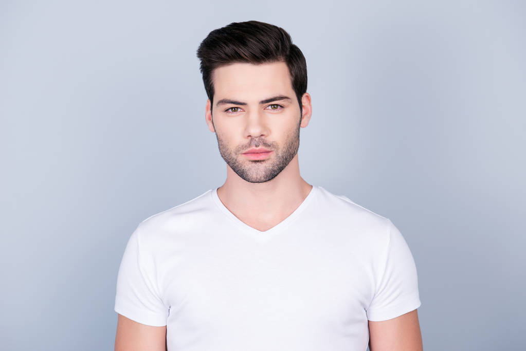 Portrait of perfect ideal man in white t-shirt with modern hairstyle soft smooth skin, isolated on grey background - Photo, Image