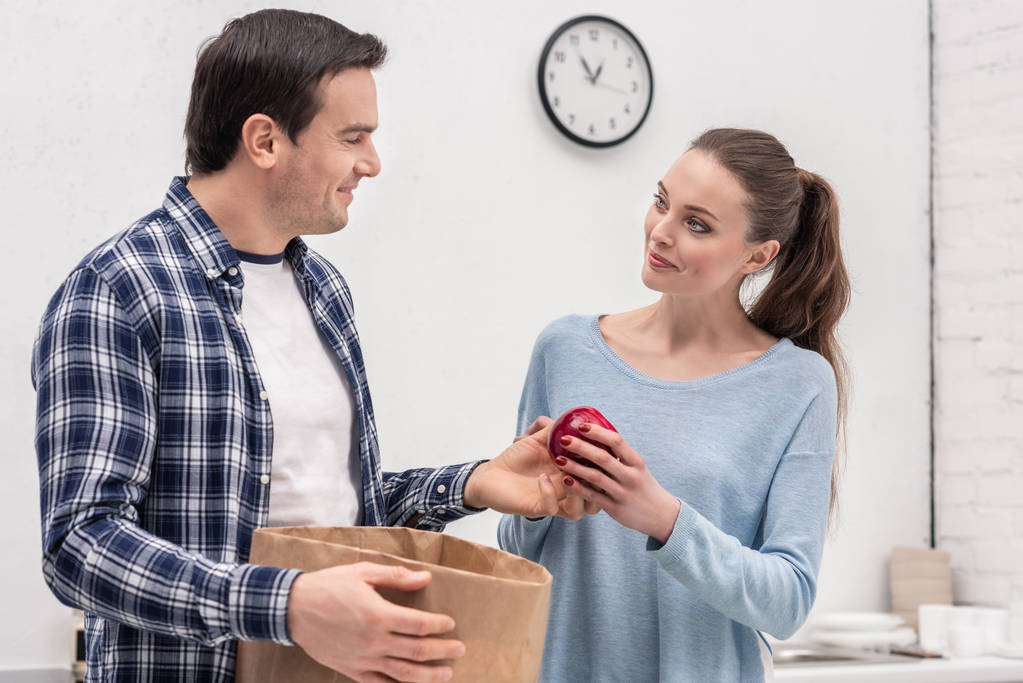 beautiful adult couple unpacking buys after grocery shopping - Photo, Image