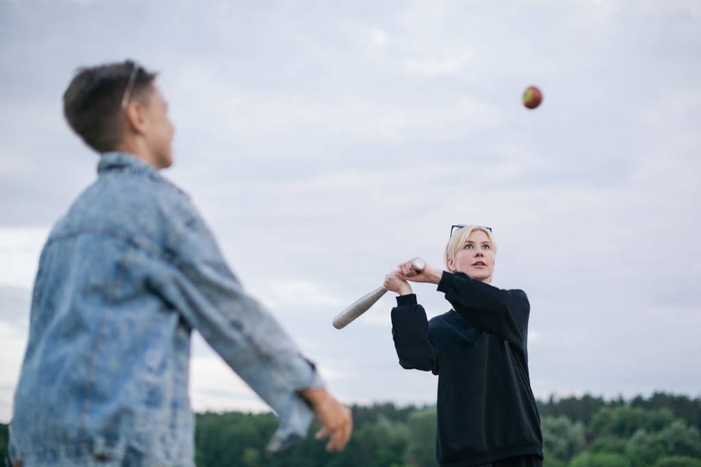 selective focus of mother and son playing baseball together outdoors - Photo, Image