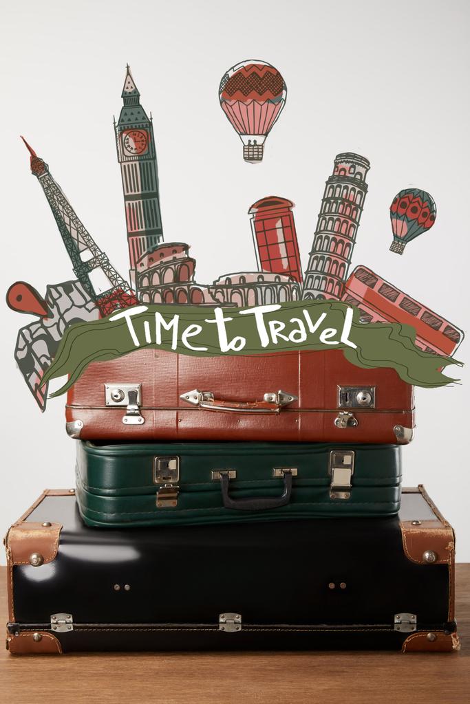 Stacked old leather suitcases with Time to travel inspiration and cities illustration - Photo, Image