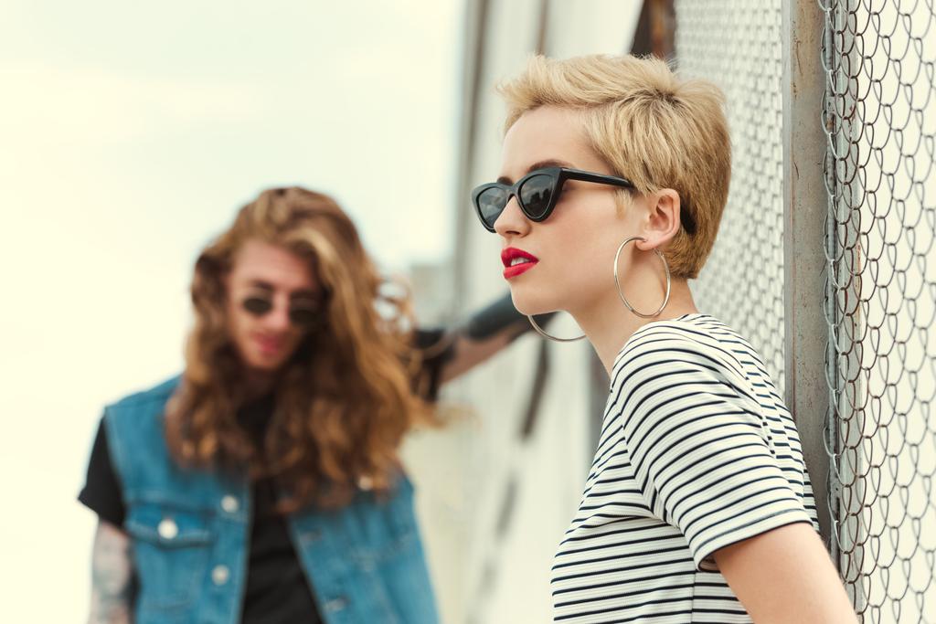 stylish girlfriend in sunglasses looking away on street - Photo, Image