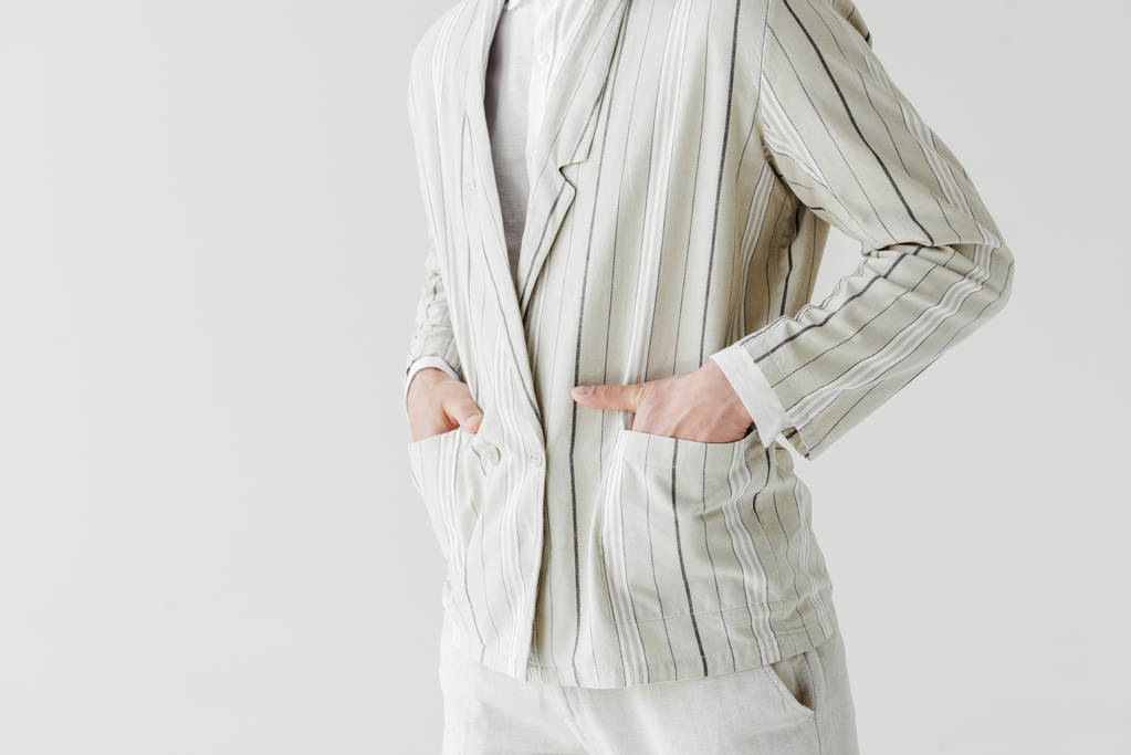 cropped shot of man in vintage striped jacket with hands in pockets isolated on white - Photo, Image