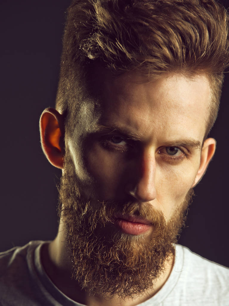 Beauty fashion portrait. man, bearded young hipster has mustache on serious face - Photo, Image