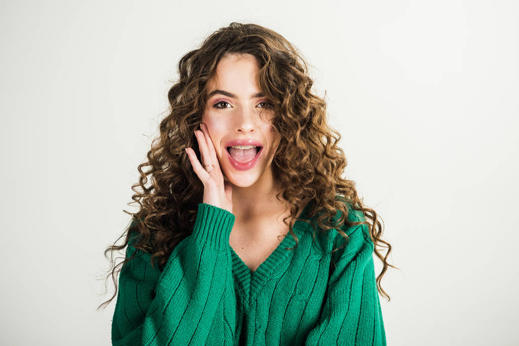 Retro girl with stylish makeup and hair in paris. retro fashion style of parisian woman with long curly hair in green sweater. - Photo, Image
