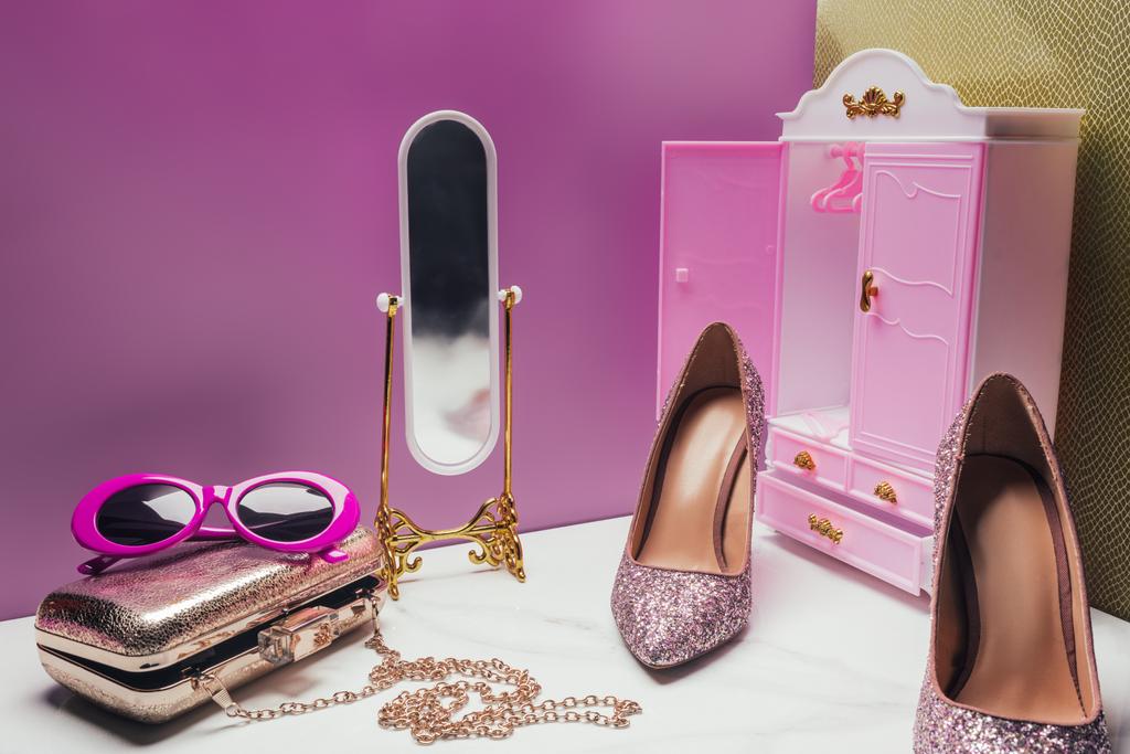 toy wardrobe and mirror with female accessories in miniature pink room - Photo, Image
