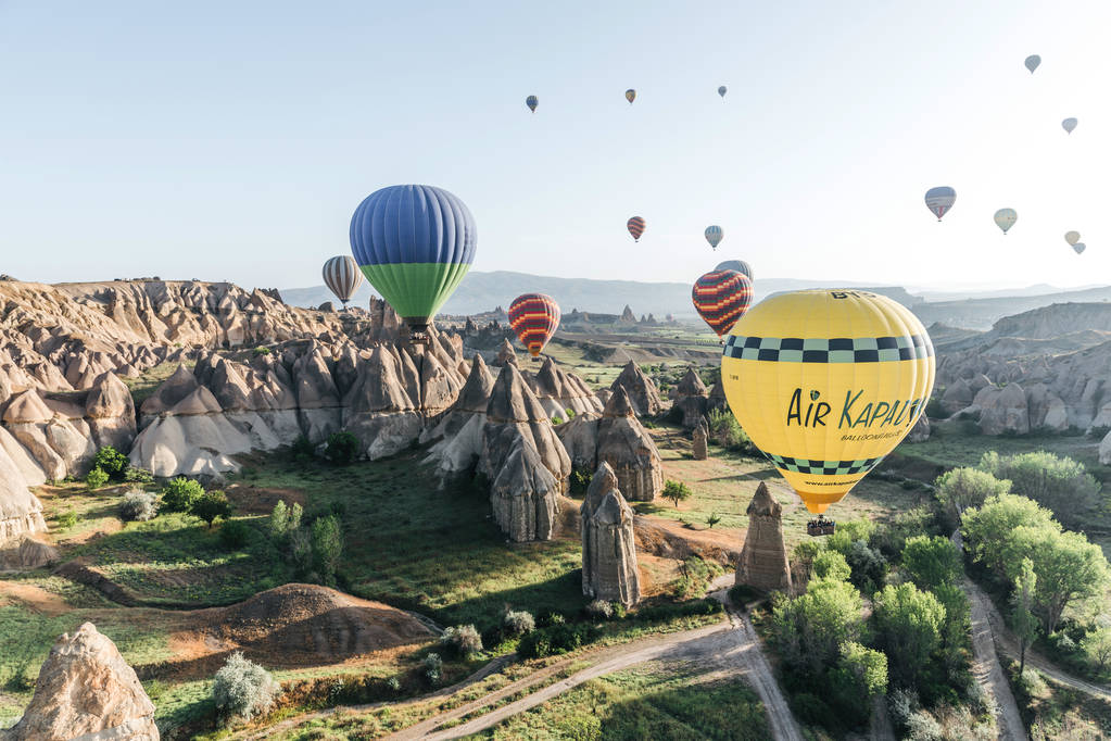 CAPPADOCIA, TURKEY - 09 MAY, 2018: colorful hot air balloons flying in sky above famous goreme national park, cappadocia, turkey    - Photo, Image
