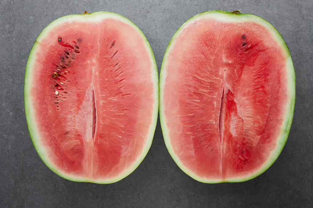 top view of ripe watermelon pieces on grey concrete tabletop - Photo, Image