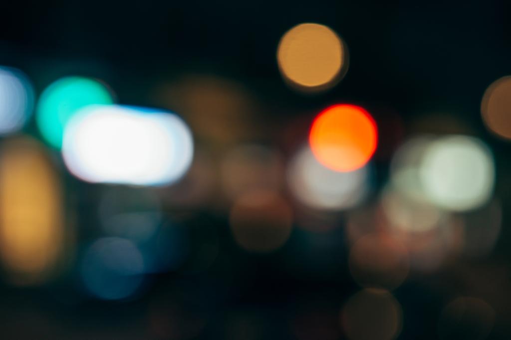 close up view of colorful bokeh lights on dark background - Photo, Image