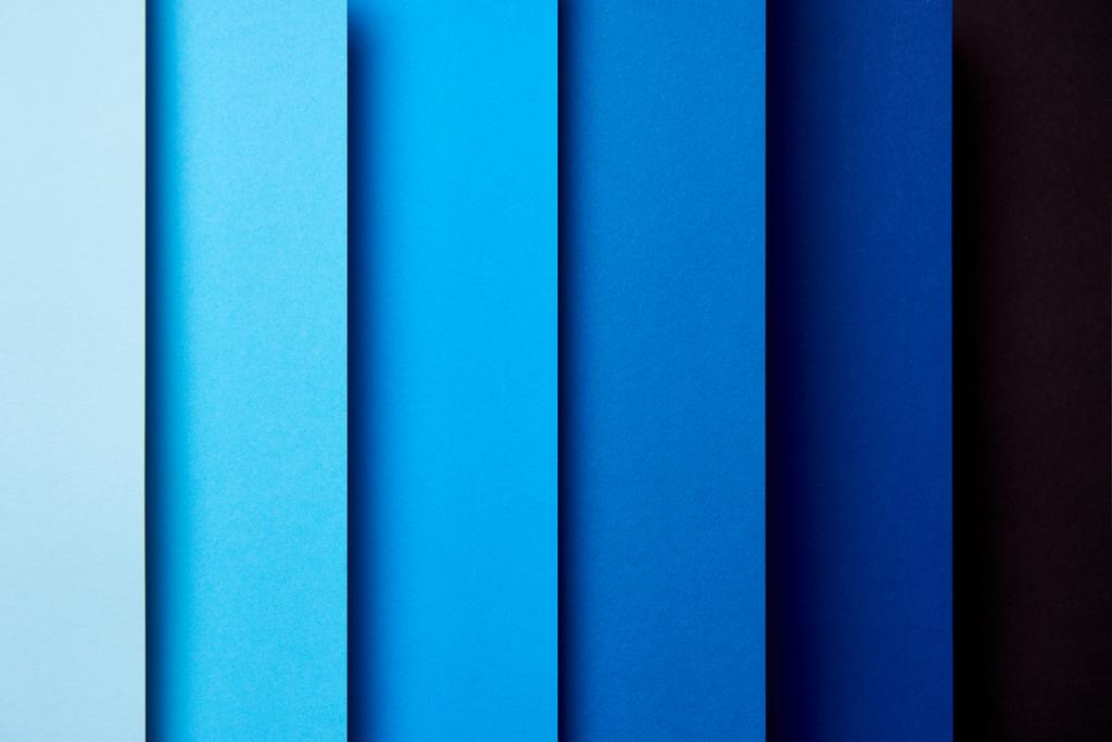 Patroon van overlappende vellen in blauwe tinten - Foto, afbeelding