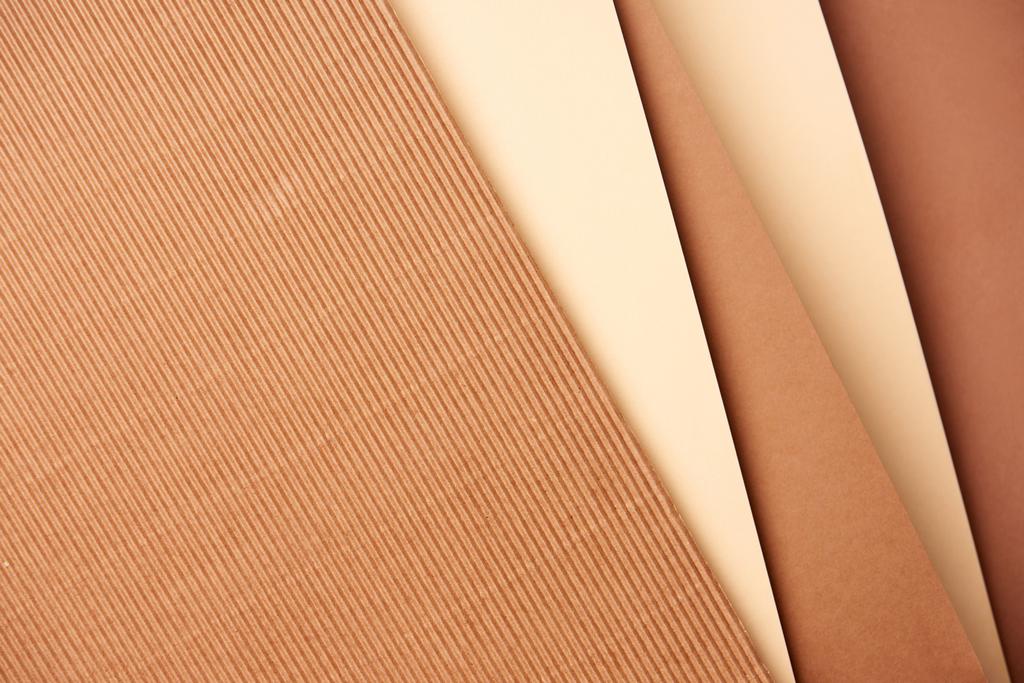 Pattern of diagonal paper sheets in beige and brown tones - Photo, Image
