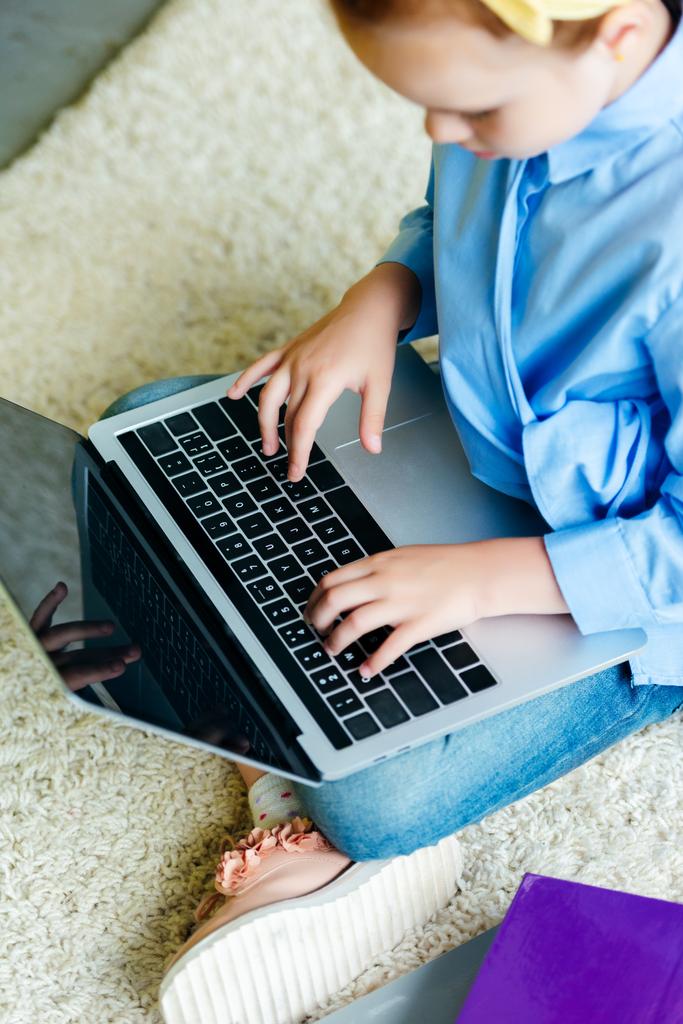 cropped shot of little child using laptop with blank screen at home  - Photo, Image