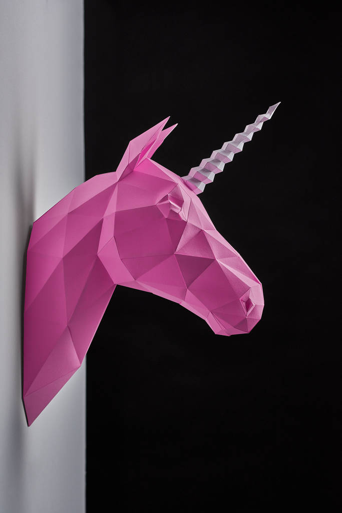 Pink saturated geometrical unicorns head. - Photo, Image