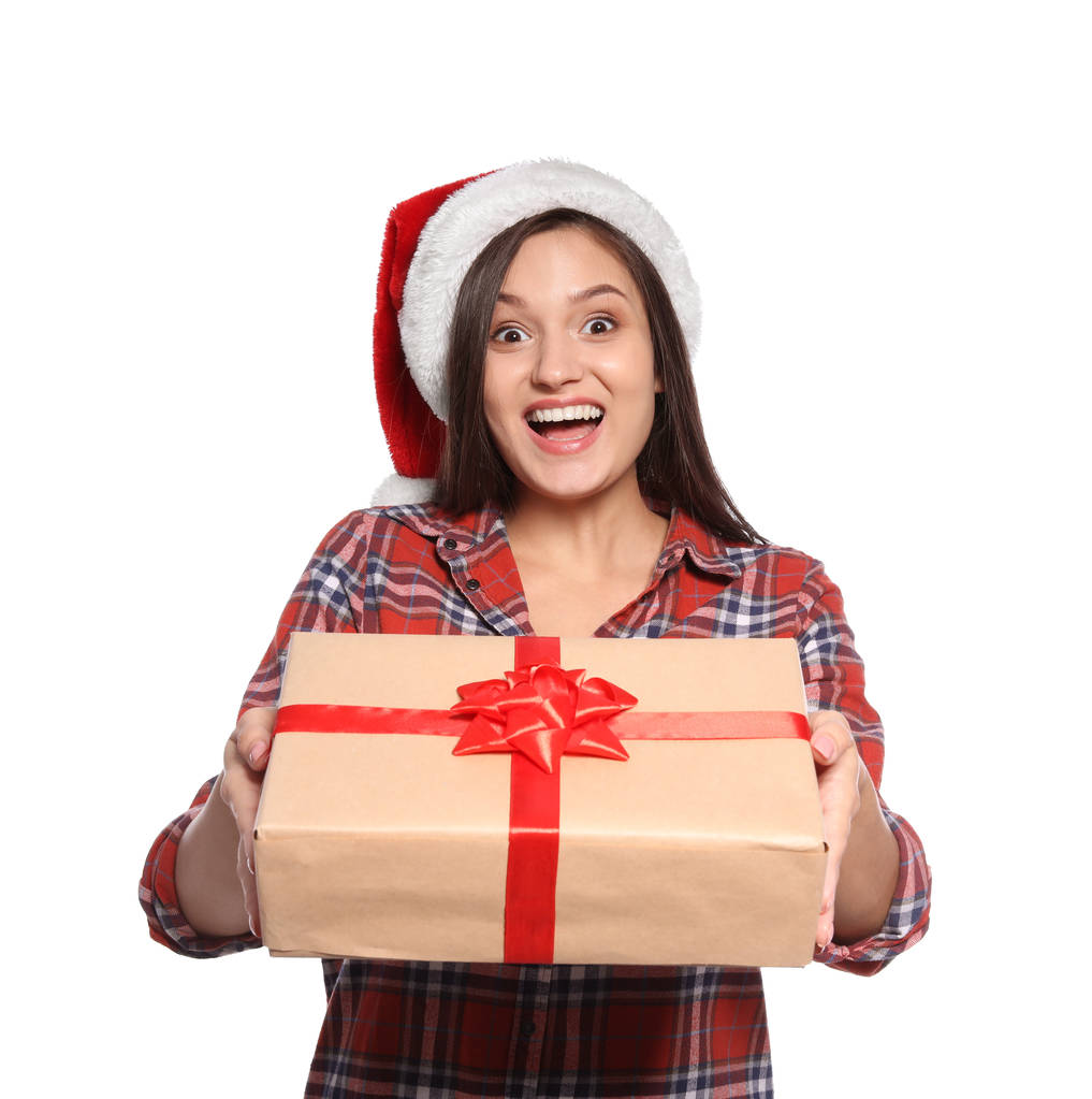 Young woman with Christmas gift on white background - Photo, Image