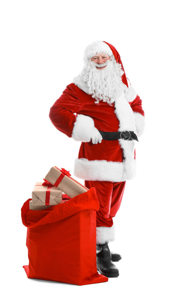 Auténtico Santa Claus con bolsa roja llena de regalos sobre fondo blanco
 - Foto, imagen