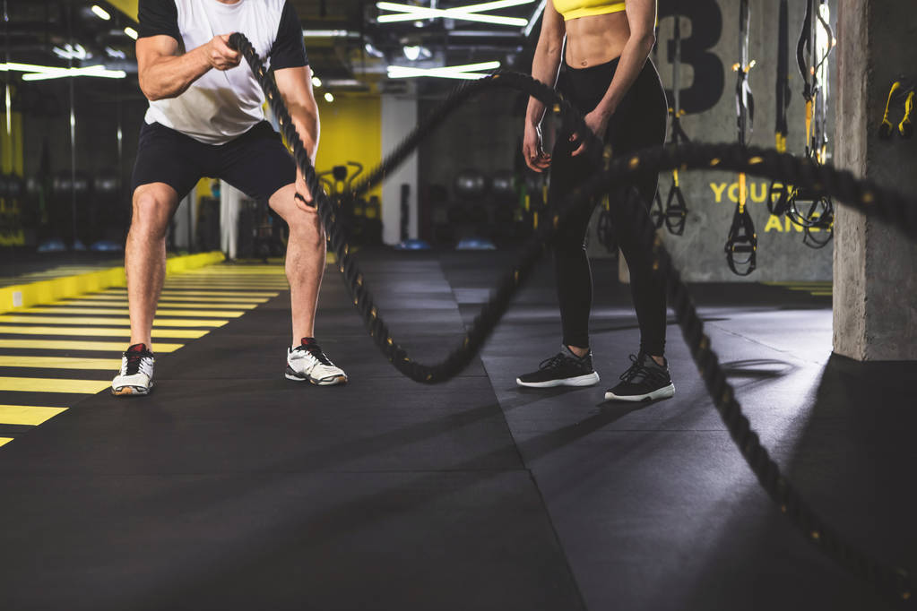 Male and woman working out in gym - Photo, Image