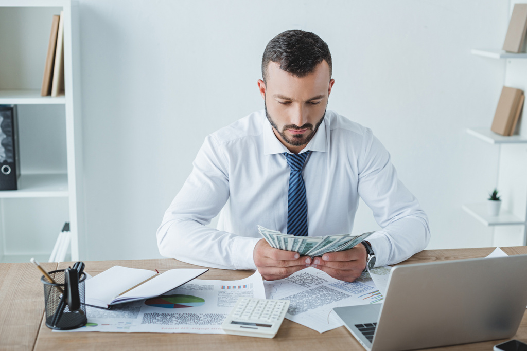 handsome business adviser counting money in office - Photo, Image
