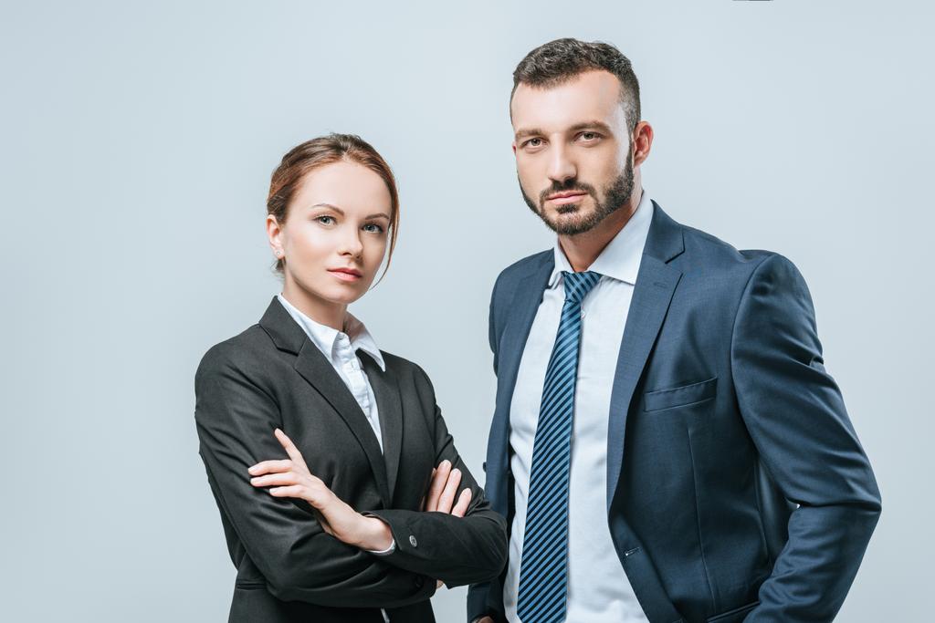 businesswoman and businessman looking at camera isolated on grey - Photo, Image