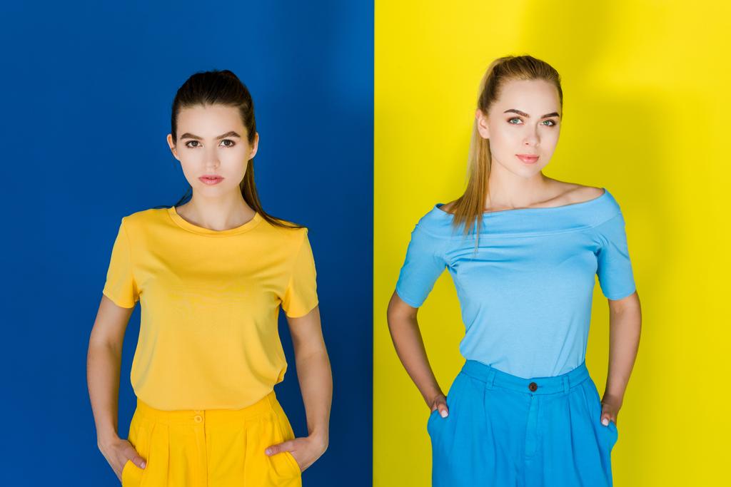 Pretty girls in summer clothes on blue and yellow background - Photo, Image