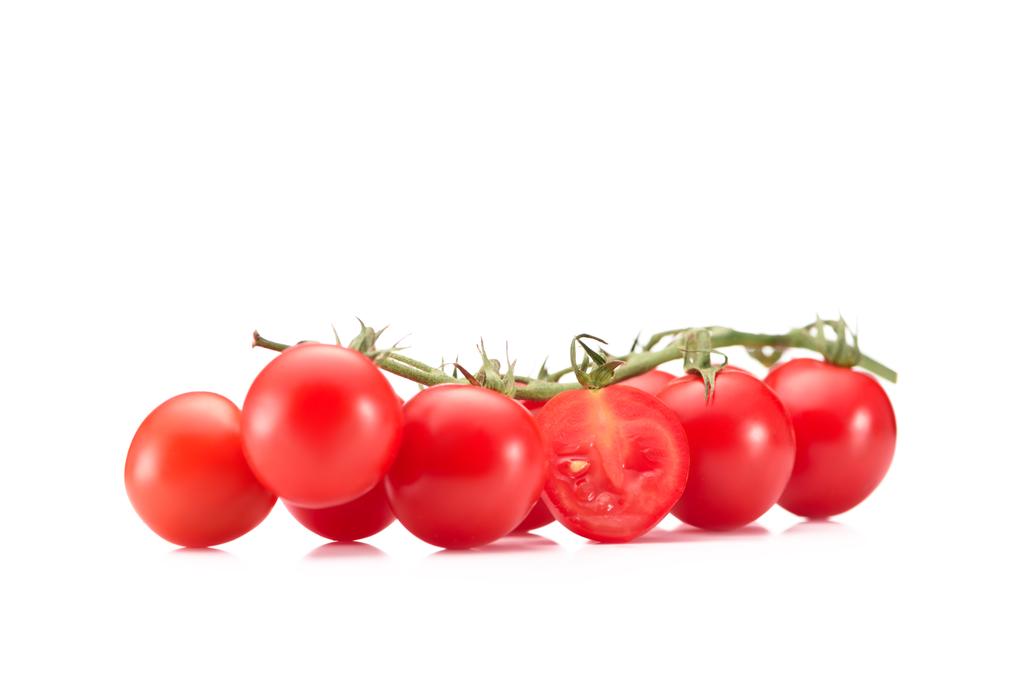 close up view of ripe cherry tomatoes on twig isolated on white - Photo, Image