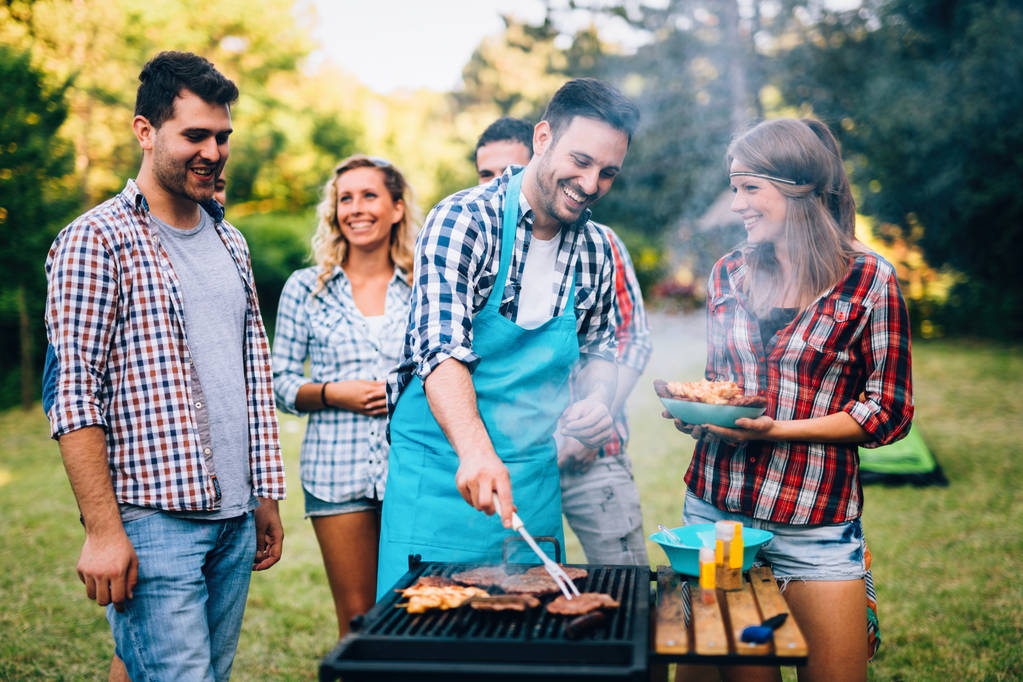 Young people having  bbq party in nature - Photo, Image