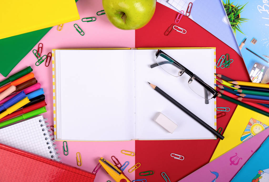 School supplies on blackboard background with copy space. Top view - Photo, Image