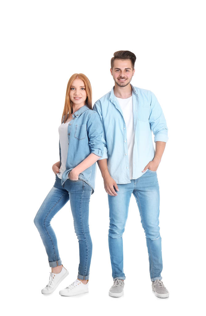 Jovem casal em jeans elegantes no fundo branco
 - Foto, Imagem