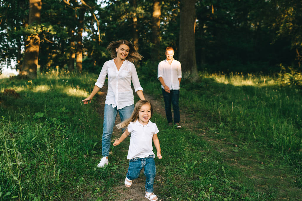 selective focus of family having fun together in forest on summer day - Photo, Image