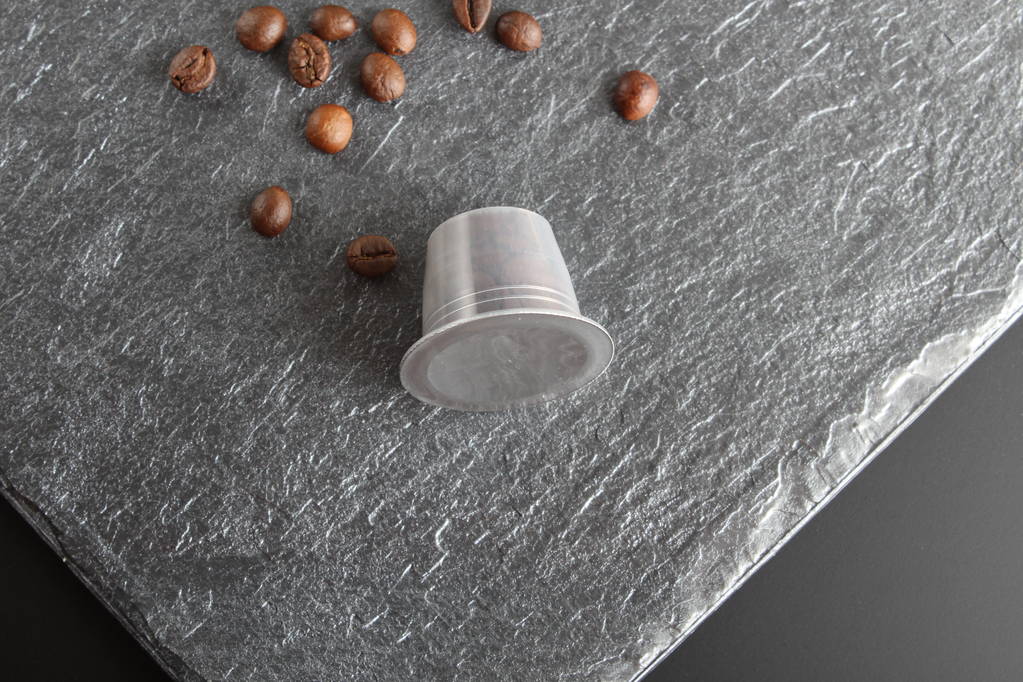 capsules of coffee on a stone background - Photo, Image