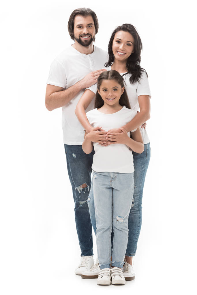 heureuse famille en chemises blanches et jeans isolés sur blanc
 - Photo, image