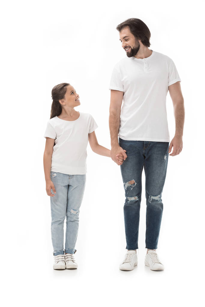 happy father and daughter holding hands and looking at each other isolated on white - Photo, Image