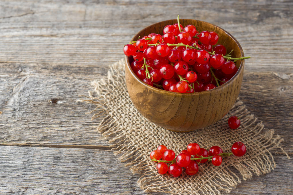Fresh red currant berries on wooden background. - Photo, Image