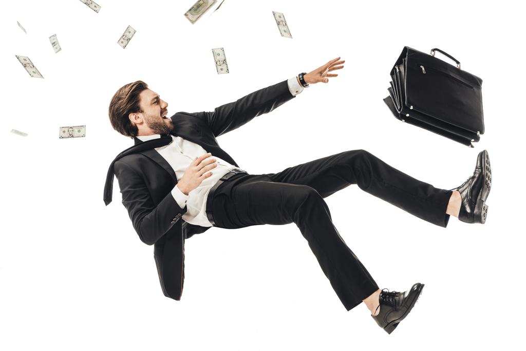 shouting young businessman falling with money and briefcase isolated on white - Photo, Image