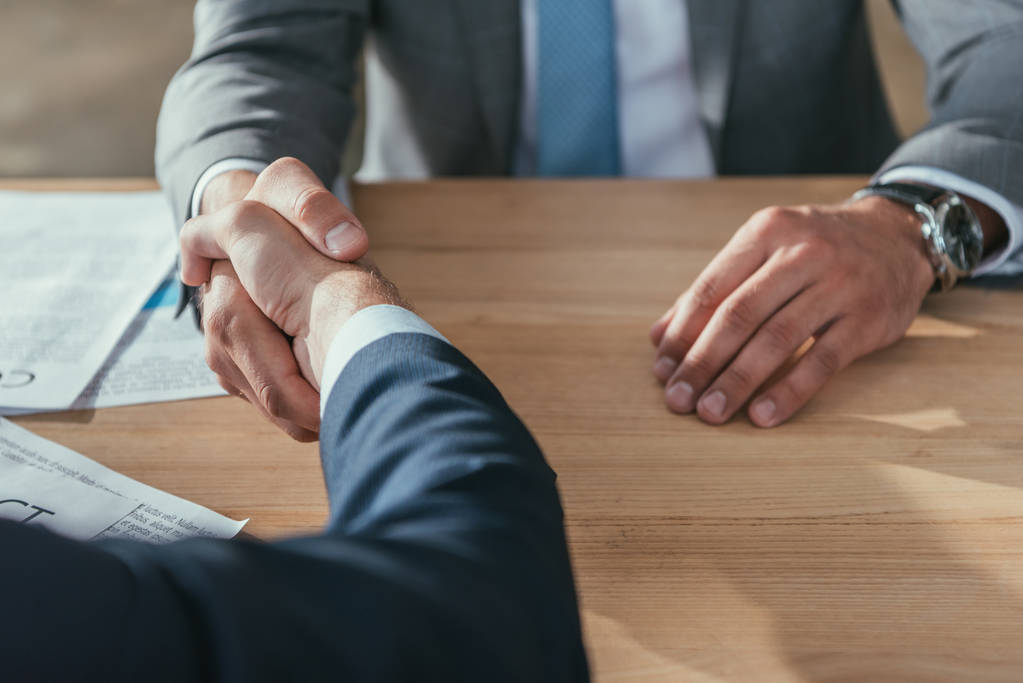 cropped shot of business partners shaking hands - Photo, Image