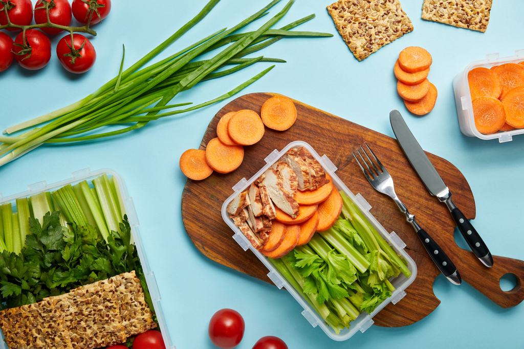 flat lay with cutlery and healthy food composition isolated on blue - Photo, Image