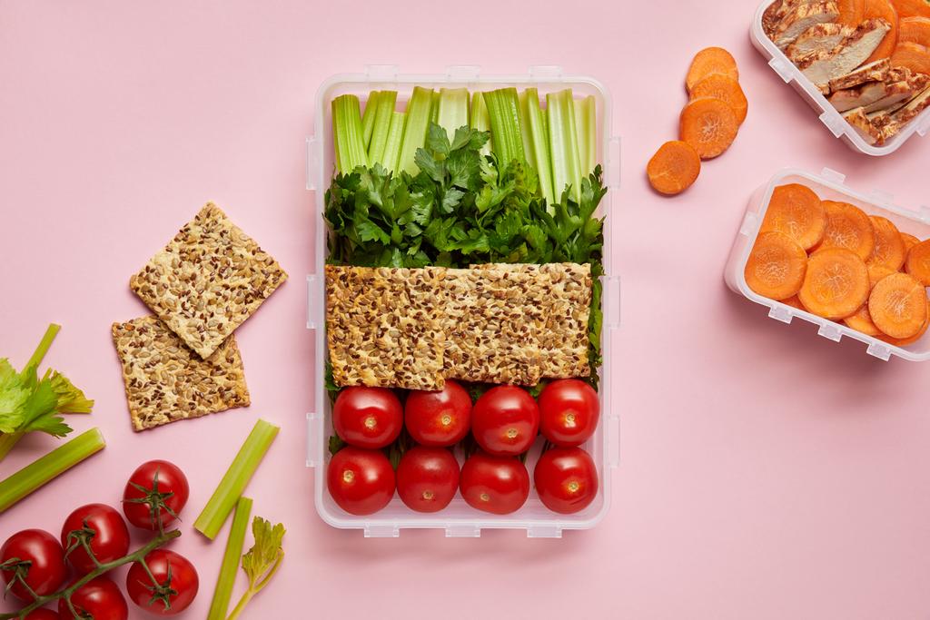 flat lay with healthy food arranged in food containers isolated on pink - Photo, Image