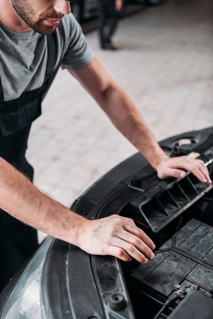 cropped view of auto mechanic repairing car - Photo, Image
