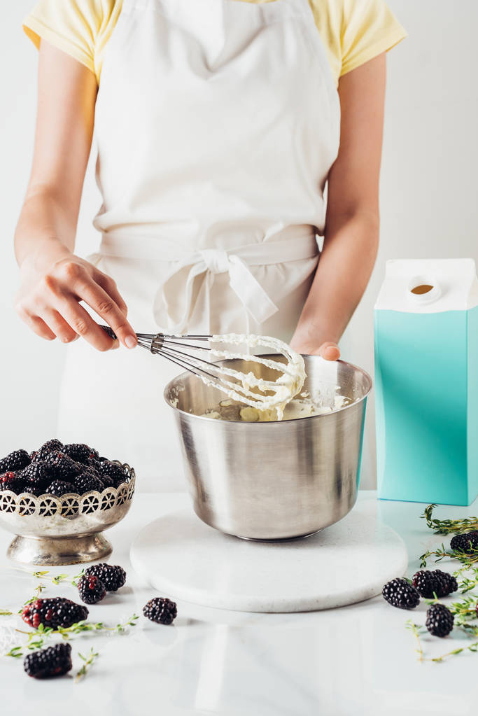cropped shot of woman preparing cream for cake with whisk - Photo, Image