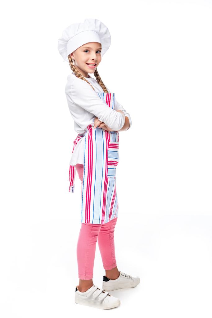 schoolchild in costume of chef standing with crossed arms isolated on white - Photo, Image