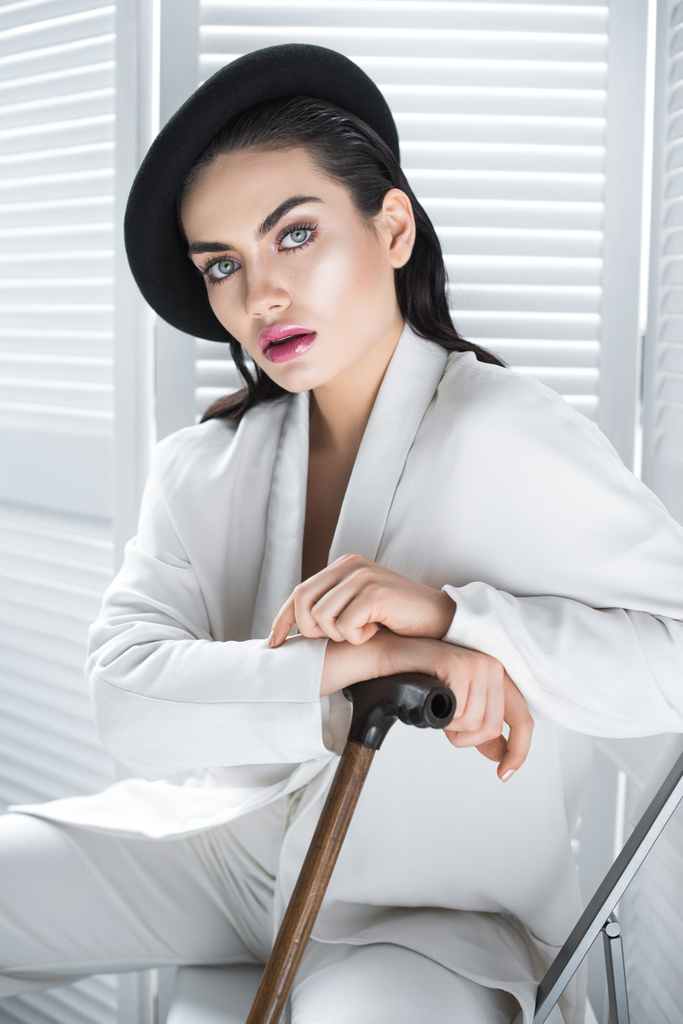 beautiful elegant woman in beret and white fashionable suit - Photo, Image