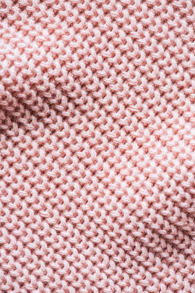 ピンクのニット紡毛生地背景の完全なフレームのイメージ - 写真・画像