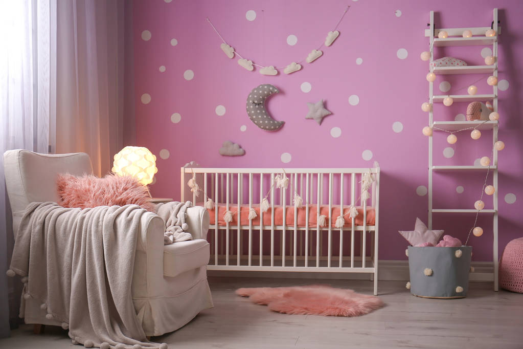 Baby room interior with crib near color wall - Photo, Image