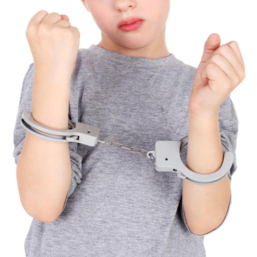 Boy with the hand cuffs - Photo, Image
