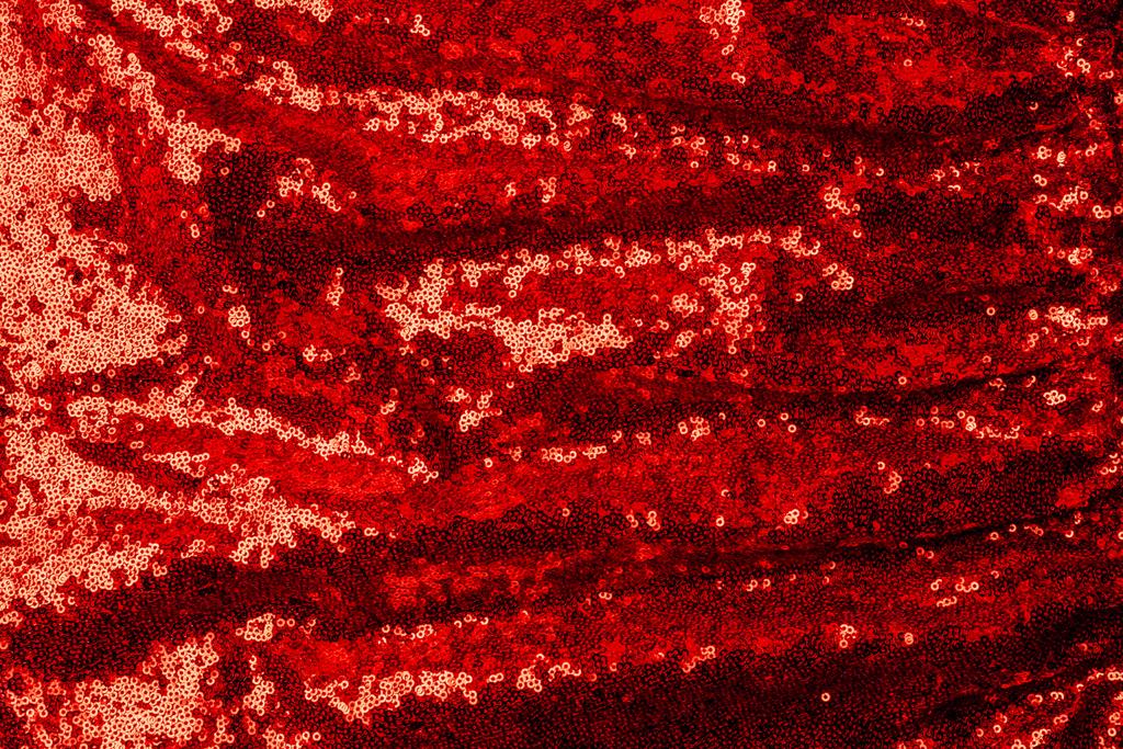 το Top view κόκκινο ύφασμα με λαμπερά πούλιες ως φόντο  - Φωτογραφία, εικόνα