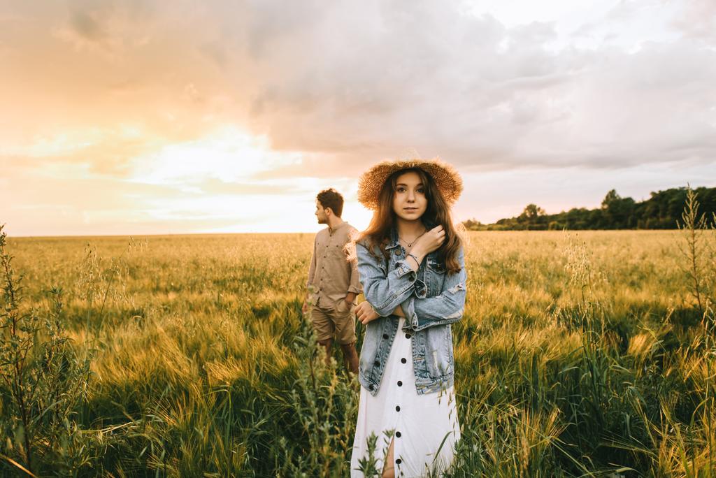 stylish couple posing on meadow with back light - Photo, Image