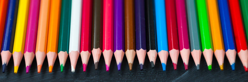 Back to School concept. Colorful pencils on blackboard background. Close up, flat lay, copy space, top view, long banner, long banner - Photo, Image